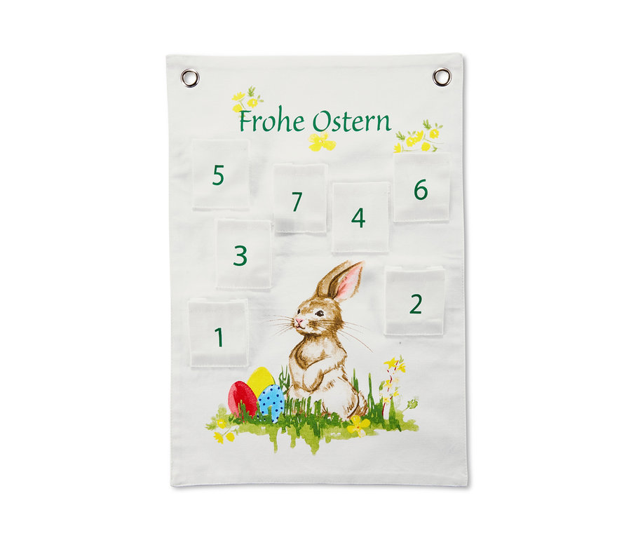Weißer Osterkalender mit Taschen und einem Bild von einem Hasen und Ostereiern.