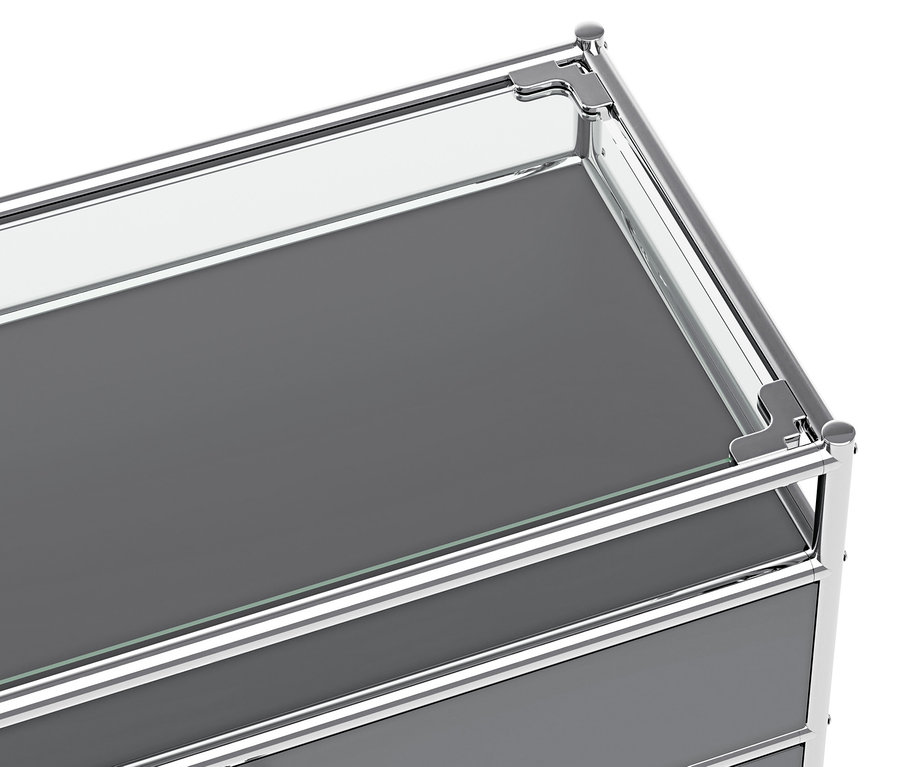 Detailansicht der grauen Metallkonsole »CN3« mit Klappfach und Schublade.