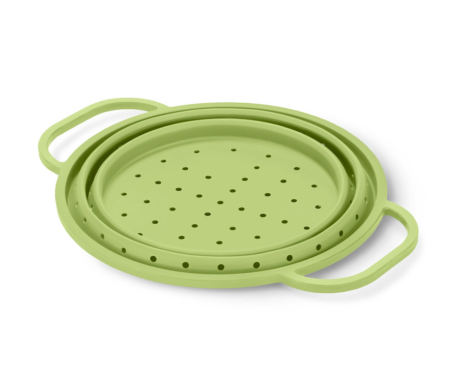 Grünes Platzspar-Sieb mit runden Löchern.