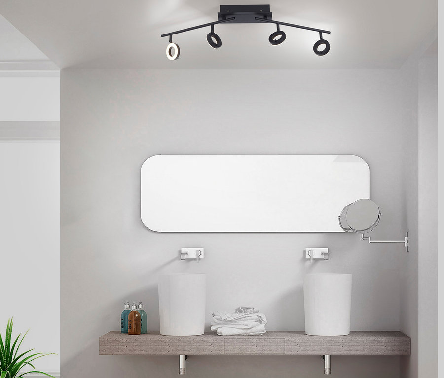 Schwarze Paul Neuhaus LED-Deckenleuchte »Sileda«, groß beleuchtet Waschbecken im Badezimmer.