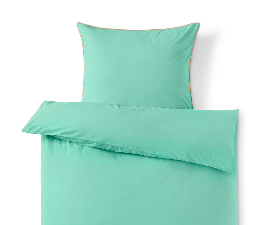 Türkise Renforcé-Bettwäsche in Normalgröße mit Kissen.