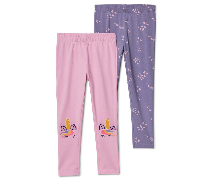 Rosa Leggings mit Einhorn-Applikation neben lila Leggings mit Sternenmuster.