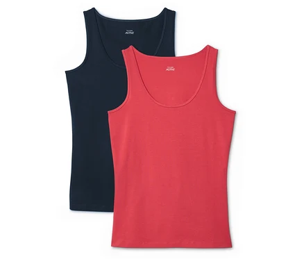 Zwei Tanktops, eines in Marineblau und eines in Rot, liegen übereinander.