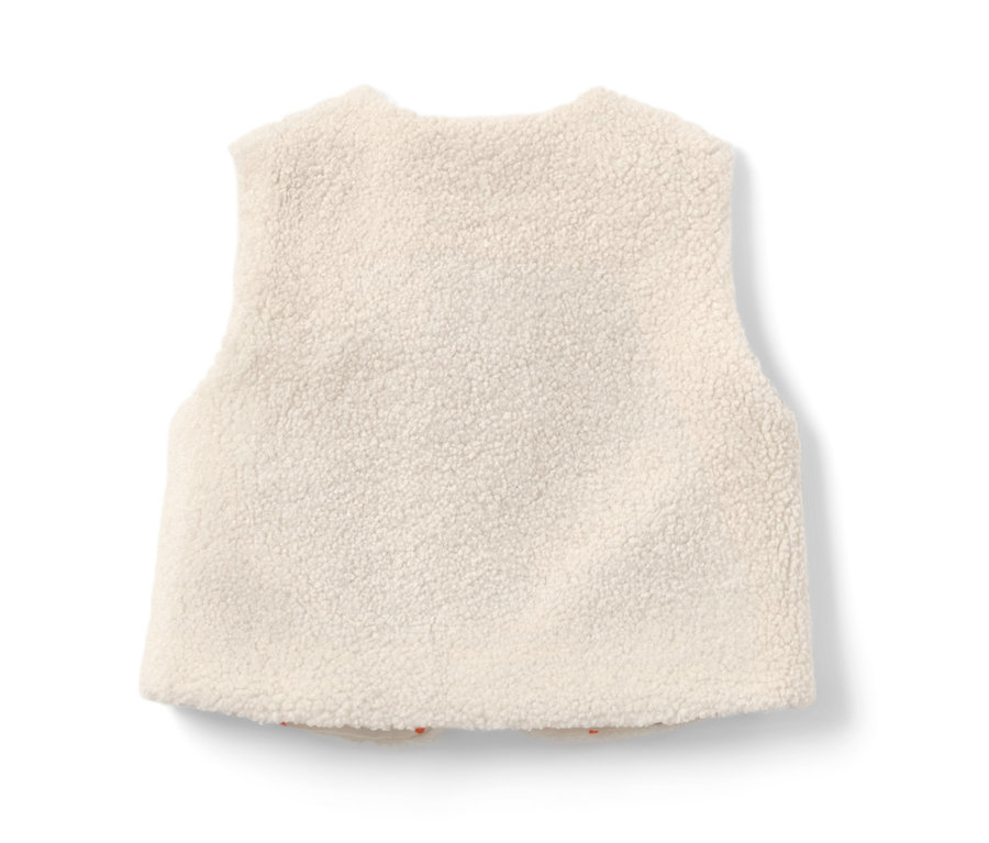 Detailansicht einer Kinder-Teddyweste in Creme.