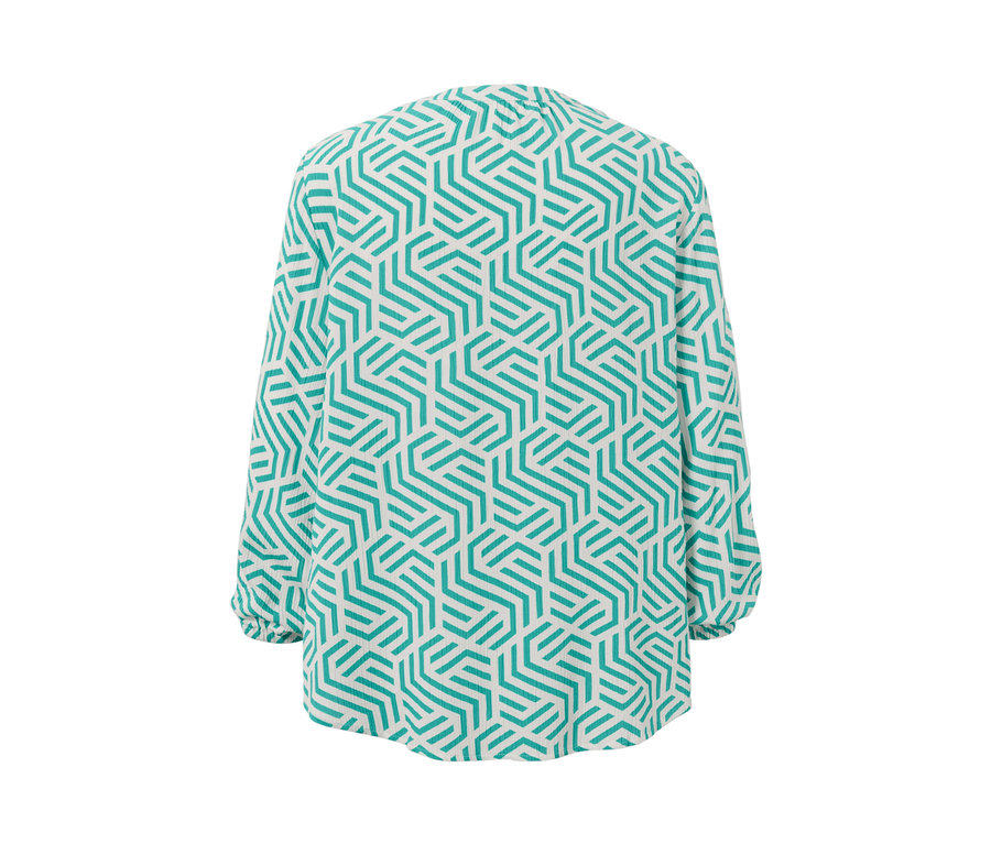 Detailansicht einer bedruckten Tunika-Bluse in Aqua mit geometrischem Muster.