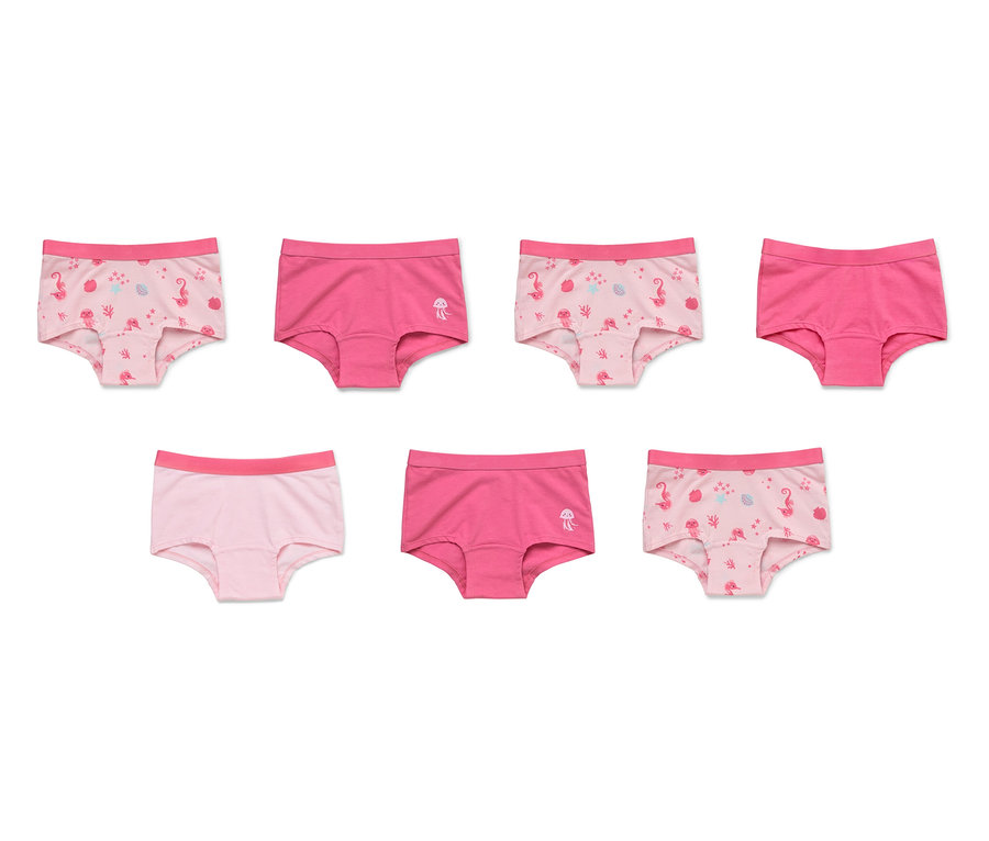 Sieben rosafarbene Slips, einige mit Flamingos und Quallen bedruckt.