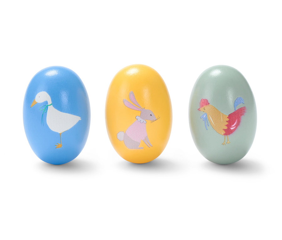 Drei Rassel-Eier mit Tiermotiven.