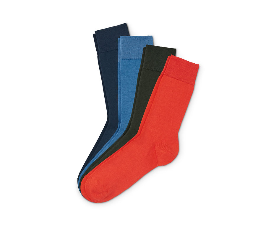 Vier Paar Merino-Socken in Dunkelblau, Rot und Dunkelgrün.