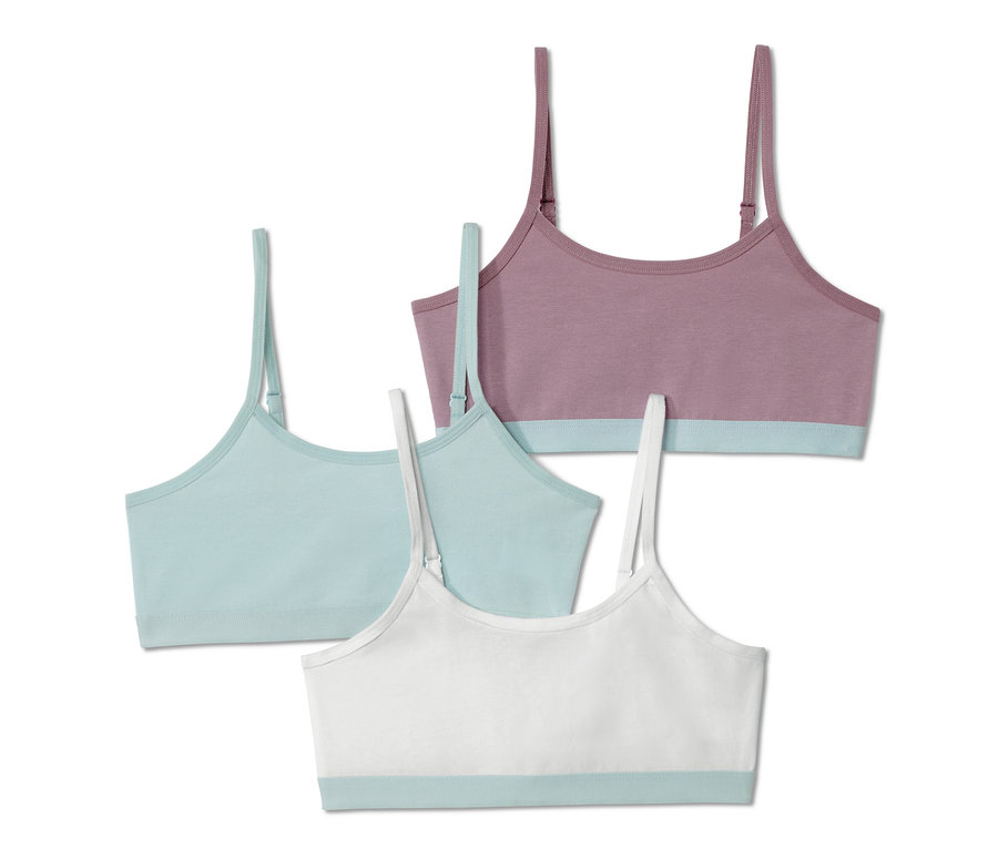 Drei Mädchen-Bustiers in Lila, Blau und Weiss.