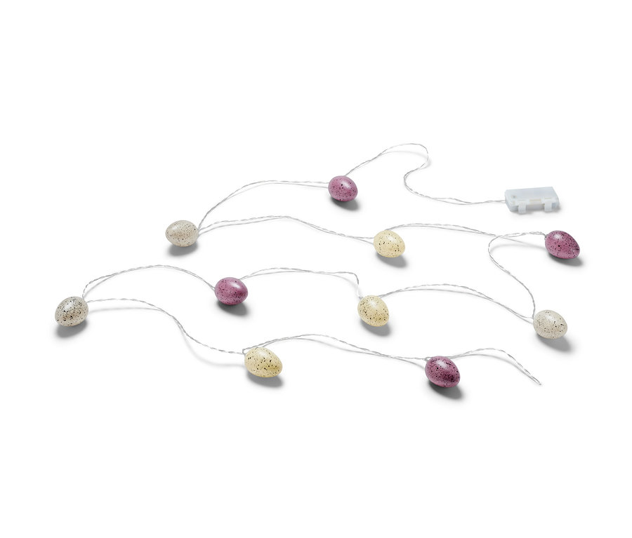 Eine LED-Lichterkette mit eiförmigen Lichtern, einige sind creme, andere lila, auf weißem Hintergrund.
