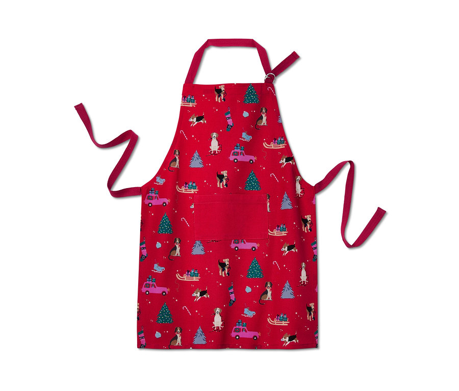 Eine rote Küchenschürze mit Weihnachtsmotiv.