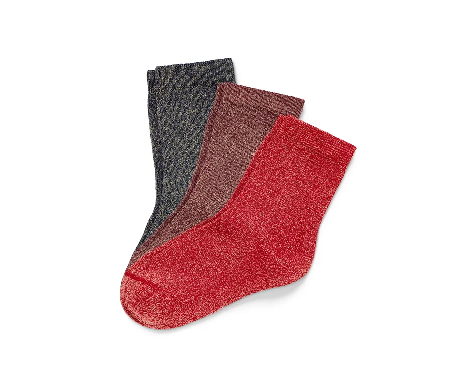 Drei Paar Kinder-Glitzersocken liegen übereinander.