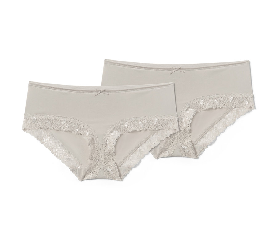 Zwei mandelfarbene Pantys mit Spitze.