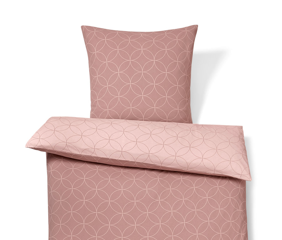 Rosa Winterjersey-Bettwäsche mit Kreismuster.