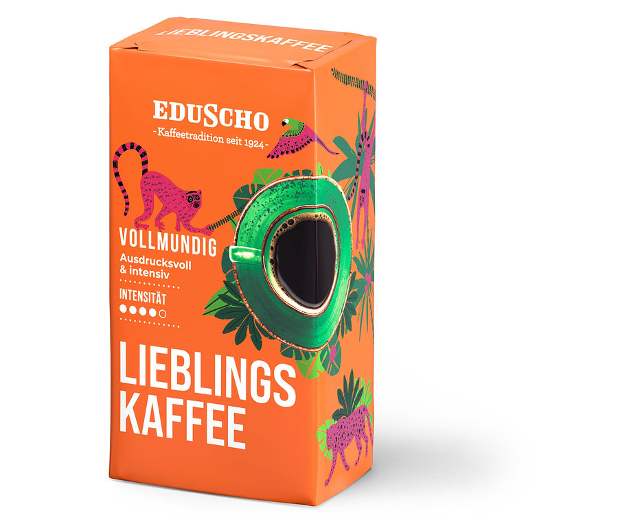 Orangefarbene Packung Eduscho Lieblingskaffee gemahlener Kaffee mit einer Abbildung einer Kaffeetasse und Dschungeltieren.