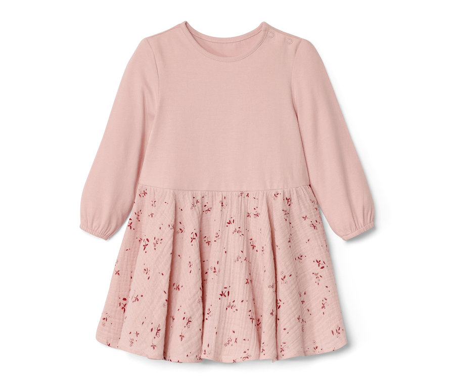 Rosa Baby-Webkleid mit langen Ärmeln und Blumenmuster auf dem Rock.