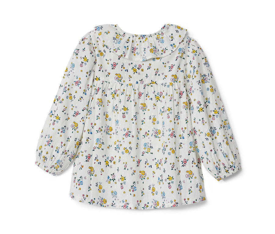 Kinder-Bluse mit langen Ärmeln und Blumenmuster.