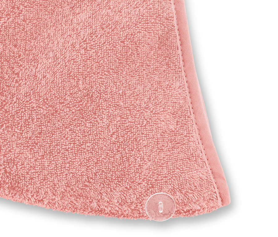 Detailaufnahme von einem roséfarbenen Turban-Handtuch.