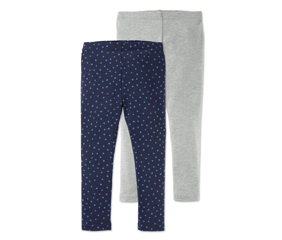 Zwei Leggings: eine dunkelblaue mit blauen Punkten und eine graue.