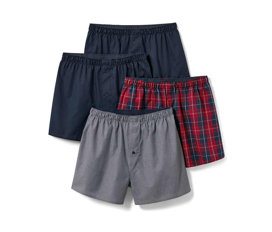Vier Web-Boxershorts in verschiedenen Farben und Mustern.