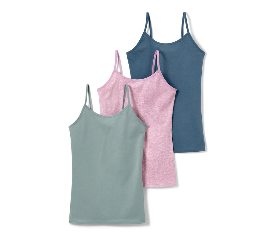 Drei Mädchen-Unterhemden in Grün, Rosa und Blau.