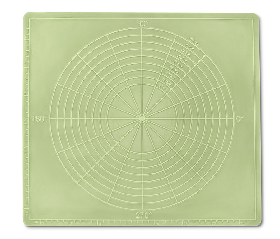 Eine grüne Dauerbackmatte mit Winkel- und Kreismarkierungen.