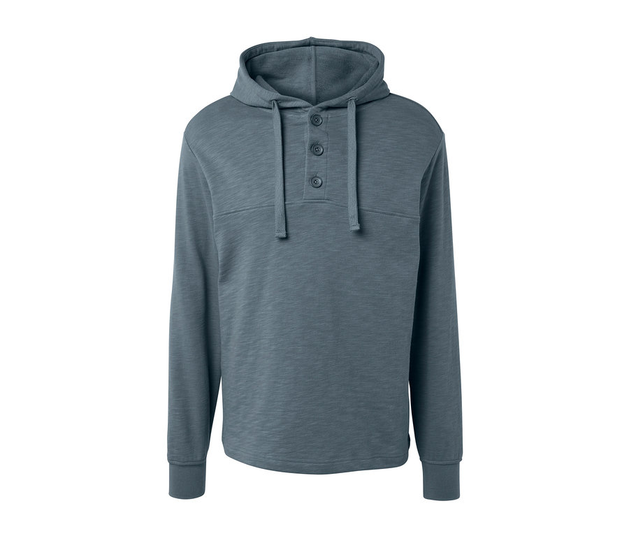 Ein grauer Hoodie mit Knöpfen.