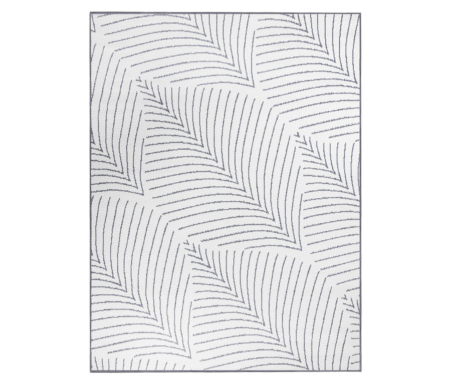 Ein weißer Teppich mit einem grauen, gezackten Linienmuster.