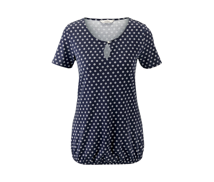 Ein blaues Blusenshirt mit weißem Muster.