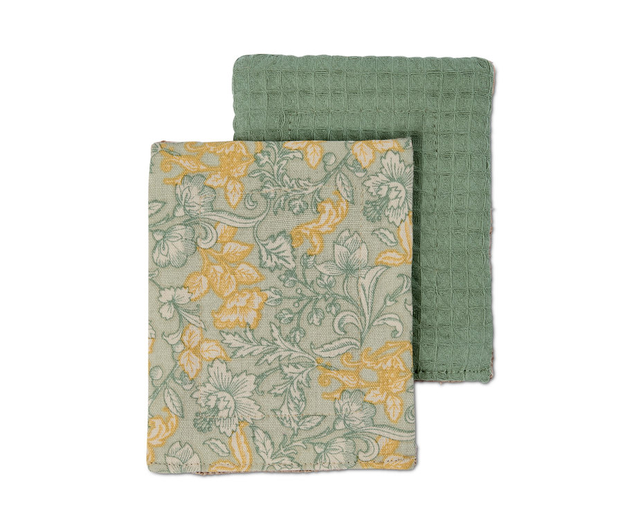 Zwei Spülschwämme: einer grün mit Waffelstruktur, einer mit Blumenmuster in Grün und Gelb.