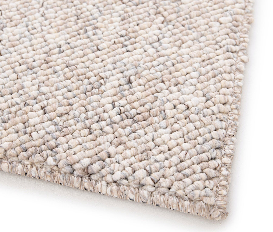 Detailansicht eines beigen Teppichs »Lino«.