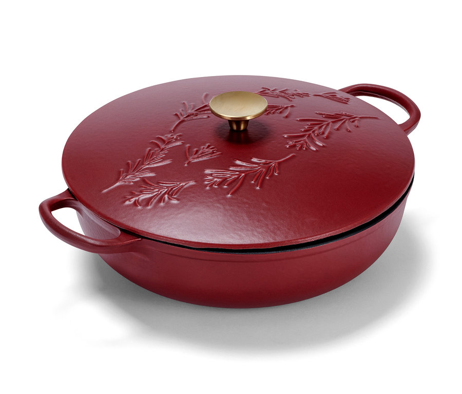 Rote Gusseisen-Servierpfanne mit Deckel und goldenem Griff.