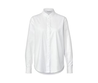 Weisse Bluse mit Rüschendetail.