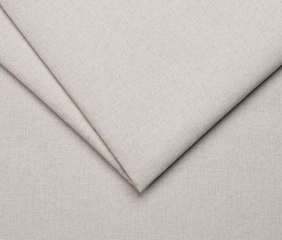 Nahaufnahme eines cremefarbenen Stoffes.