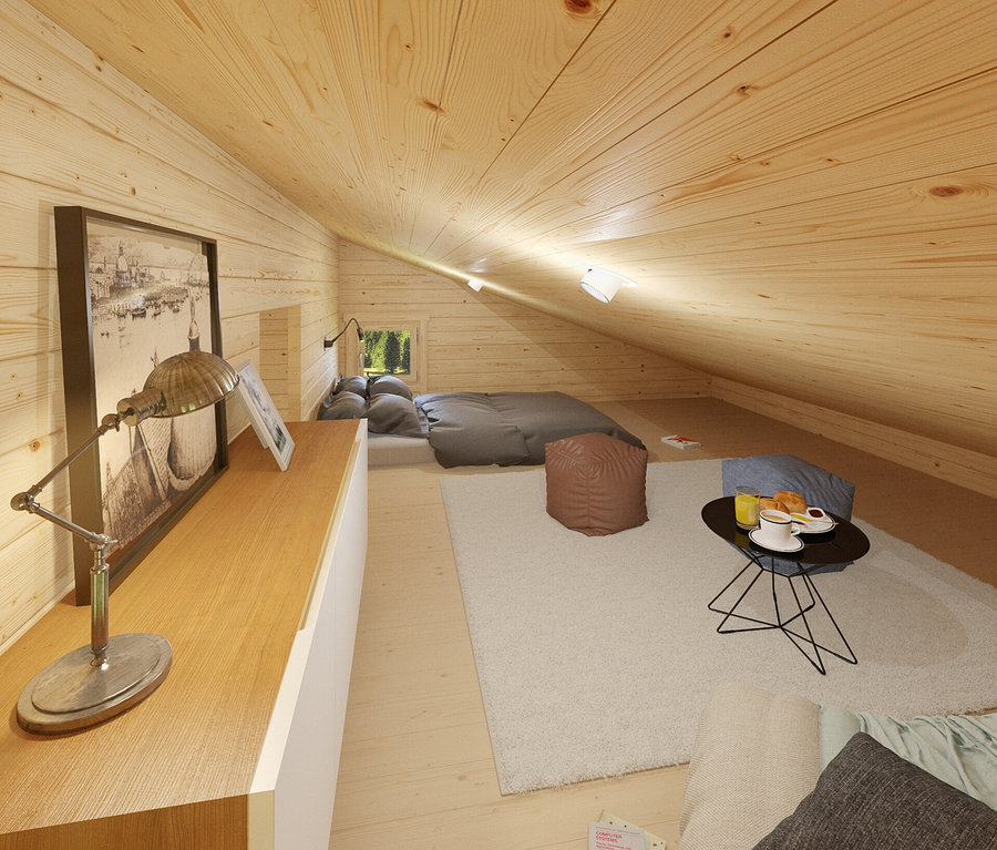 Innenansicht eines Dachgeschosszimmers mit Holzverkleidung an Wänden und Decke. Im Zimmer befinden sich ein Bett, ein Tisch mit Essen und eine Lampe.