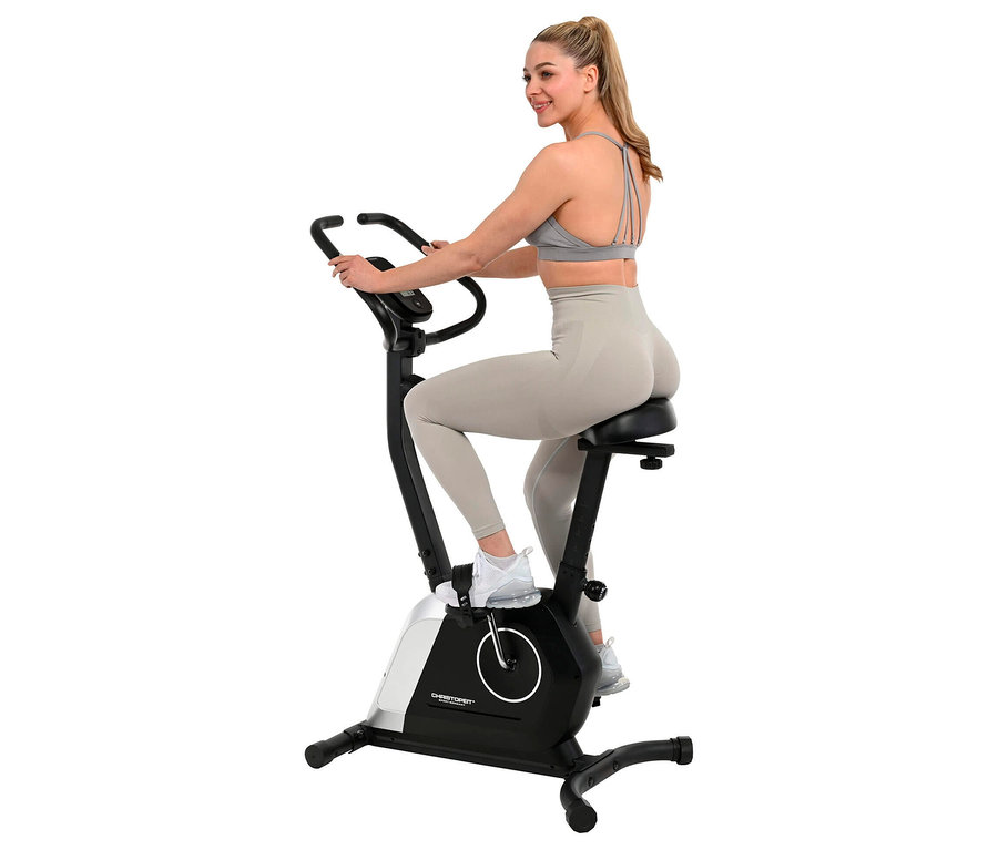 Frau benutzt Christopeit Heimtrainer »Active« in Sportkleidung.