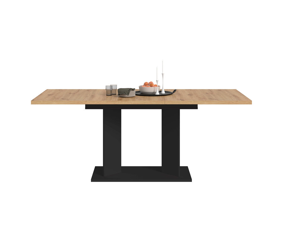 xonox Esstisch Victor mit holzfarbener Platte und schwarzem Gestell, darauf zwei Gläser, Servietten, eine Schale mit Orangen und Kerzenständer.