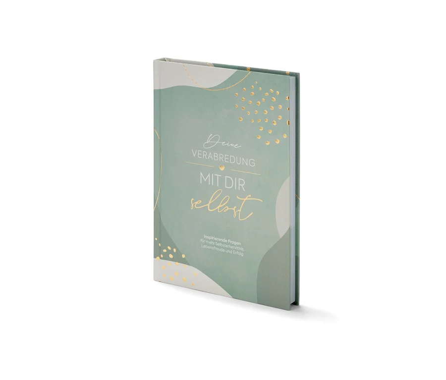 Das Buch »Deine Verabredung mit dir selbst« liegt auf einer weißen Oberfläche.