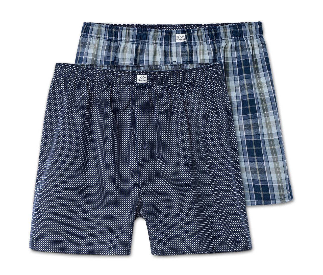 Zwei Webboxershorts: eine dunkelblaue mit weißen Punkten und eine blau-grün karierte.