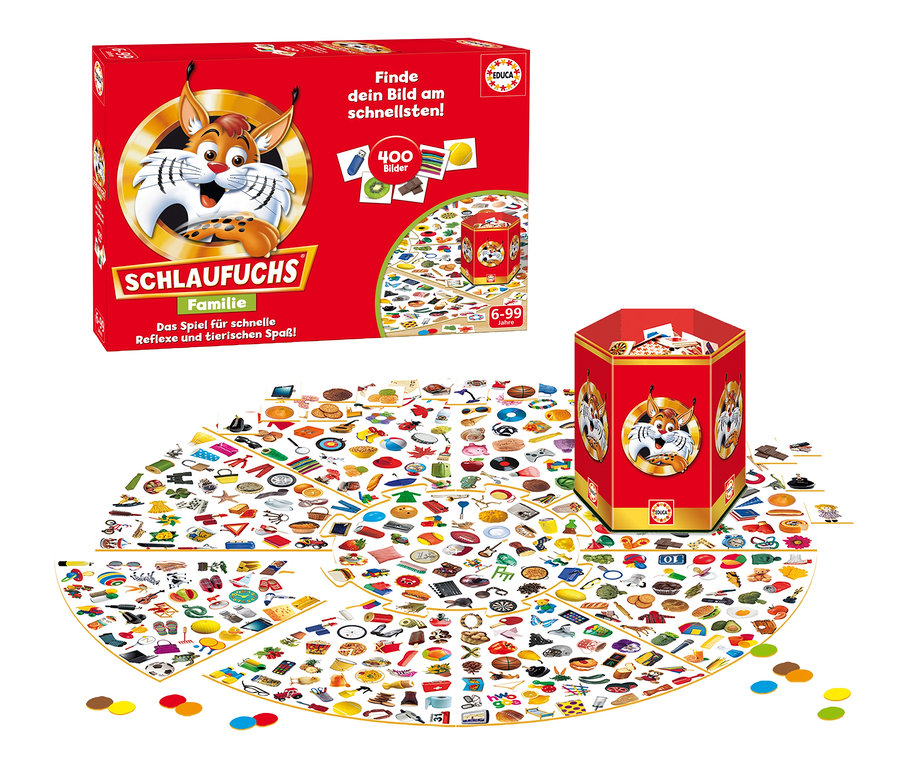Das Spiel »Schlaufuchs Familie« ist mit Spielbrett, Schachtel und Turm auf einem Tisch ausgebreitet.