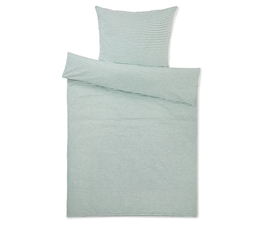 Bettwäsche-Set mit Kissen und Decke, mit grünen Streifen auf weißem Grund.