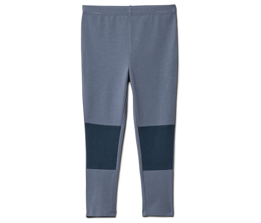 Graue Leggings mit marineblauen Kniepatches liegen auf einem weißen Hintergrund.