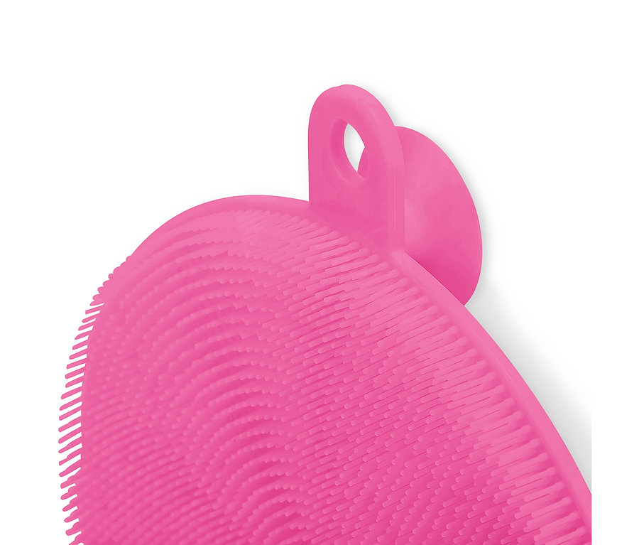 Nahaufnahme einer pinkfarbenen Silikonbürste mit Schlaufe und Noppen.