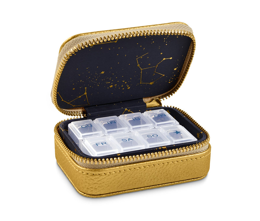 Geöffnete goldene Pillendose mit durchsichtigen Pillenfächern innen.