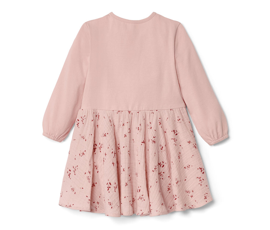 Rosa Baby-Webkleid mit langen Ärmeln und Blumenmuster auf dem Rock.