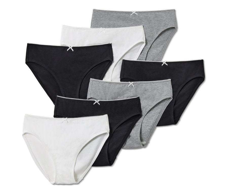 7 Kinder-Slips, weiß, grau und schwarz.