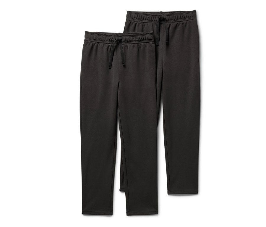 Zwei Kinder-Sporthosen liegen übereinander.