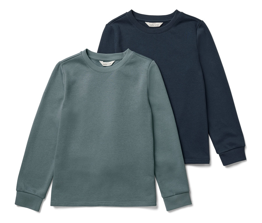 Zwei Kinder-Sweatshirts mit angerauter Innenseite, blau und salbei, liegen nebeneinander.