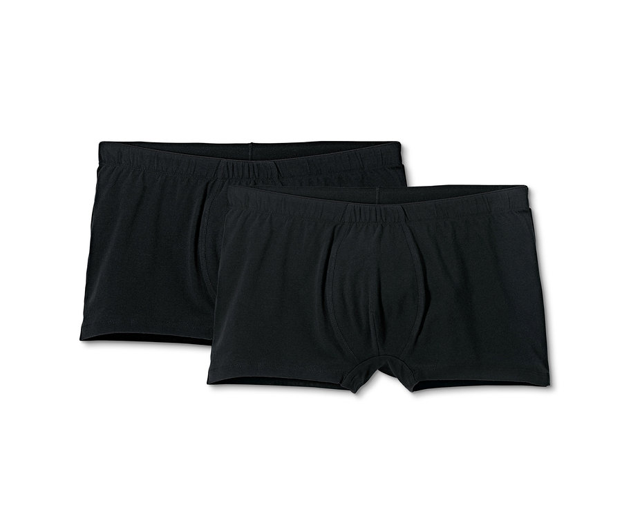 Zwei schwarze Herren Boxershorts liegen nebeneinander.