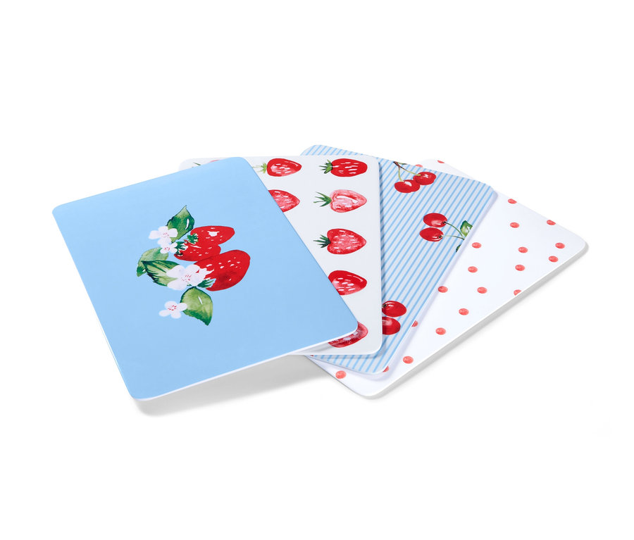 Vier Schneidebretter mit Obstmotiven.